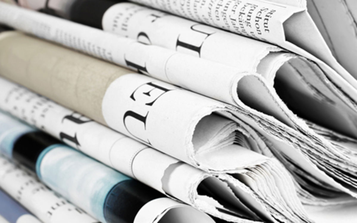 Close up of stack of printed and folded newspapers