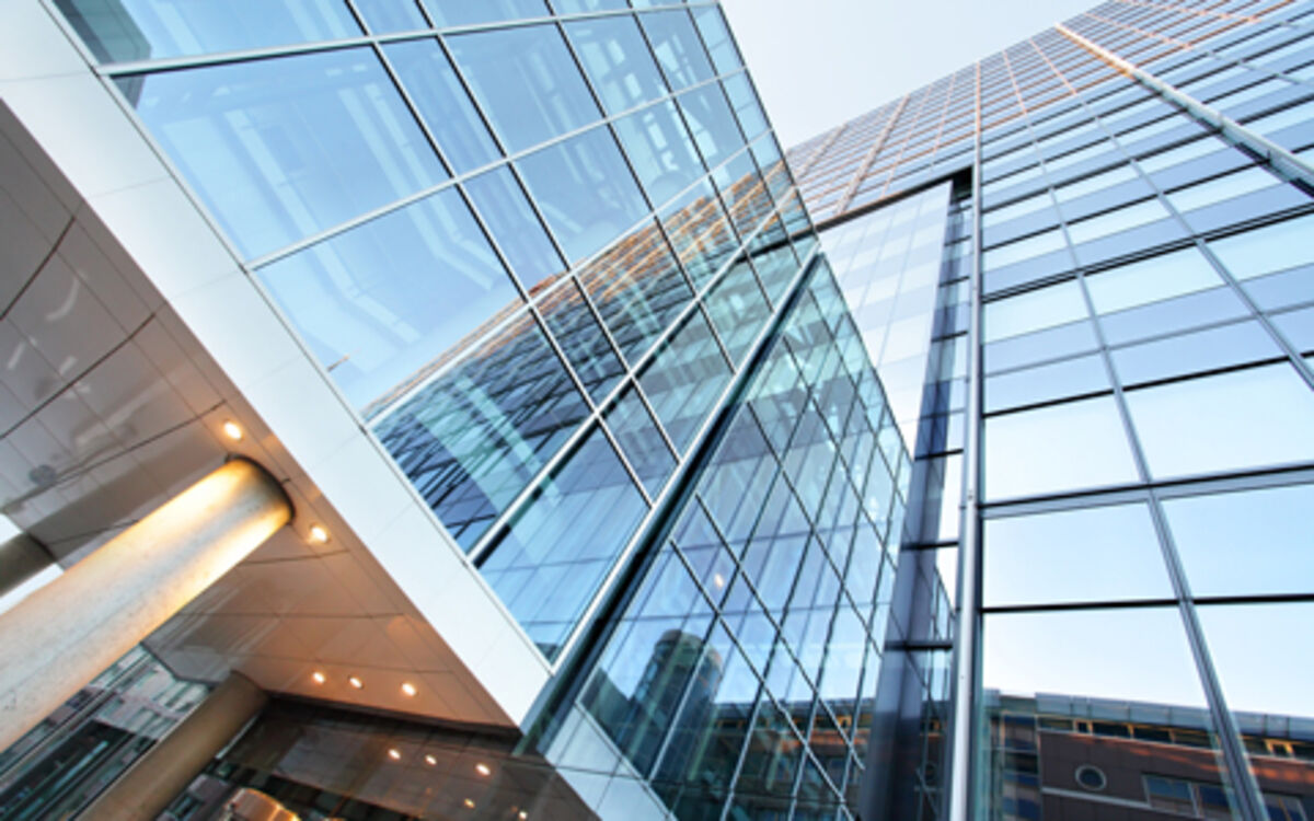 Glass office building viewed from bottom to top